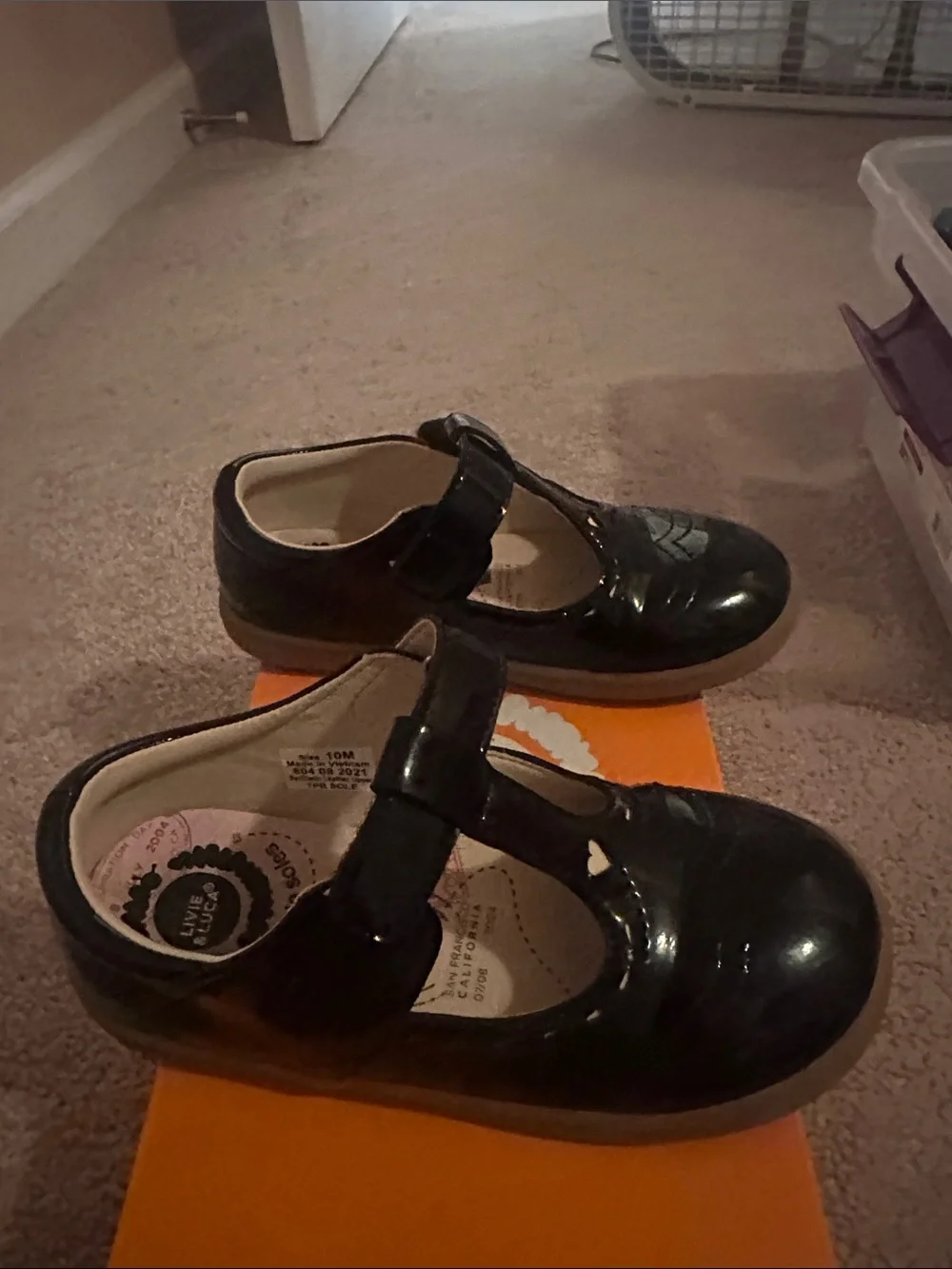 Livie & Luca Black Patent T-Strap Mary Janes with Heart Cutouts